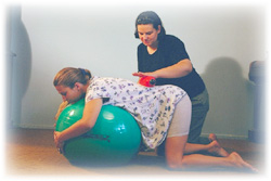 Putting all of your upper body weight on the Birth Balls when in the hands and position